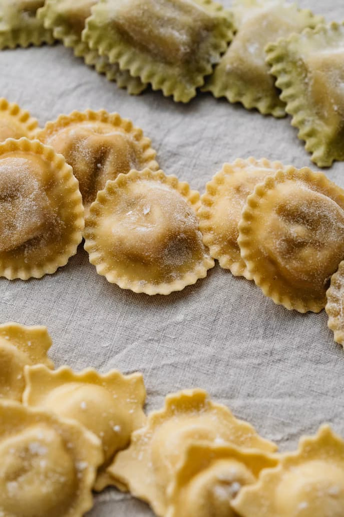 Fresh ravioli on a wooden board