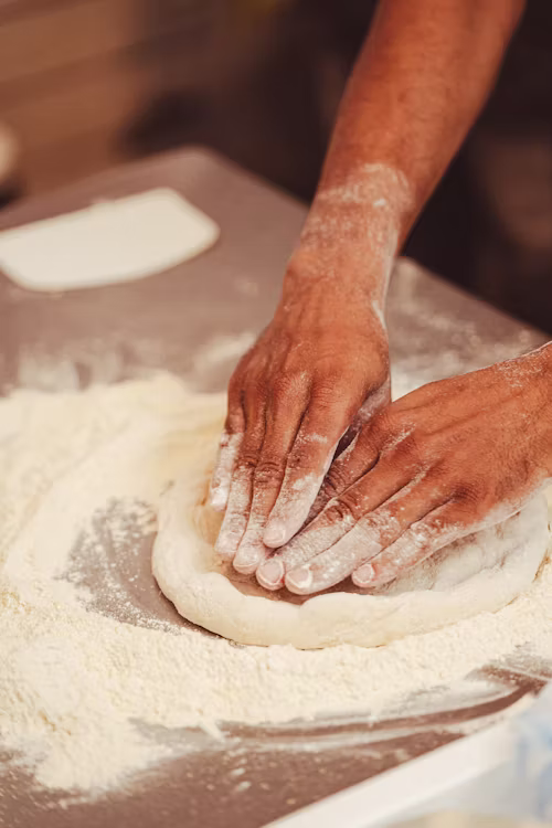 Rounding pizza dough balls
