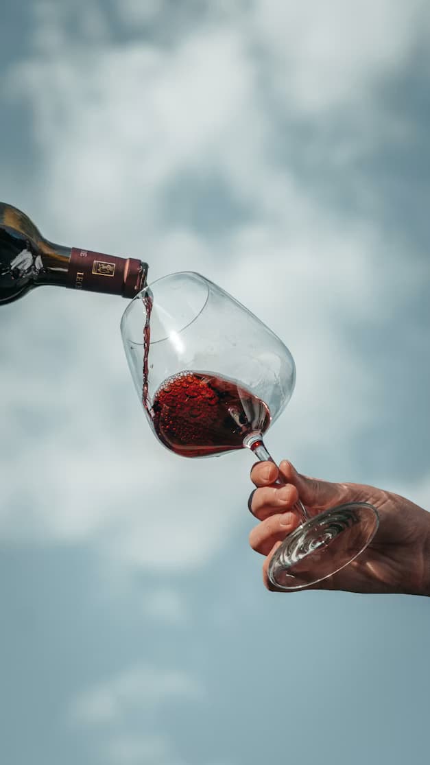 Red wine being poured into a glass